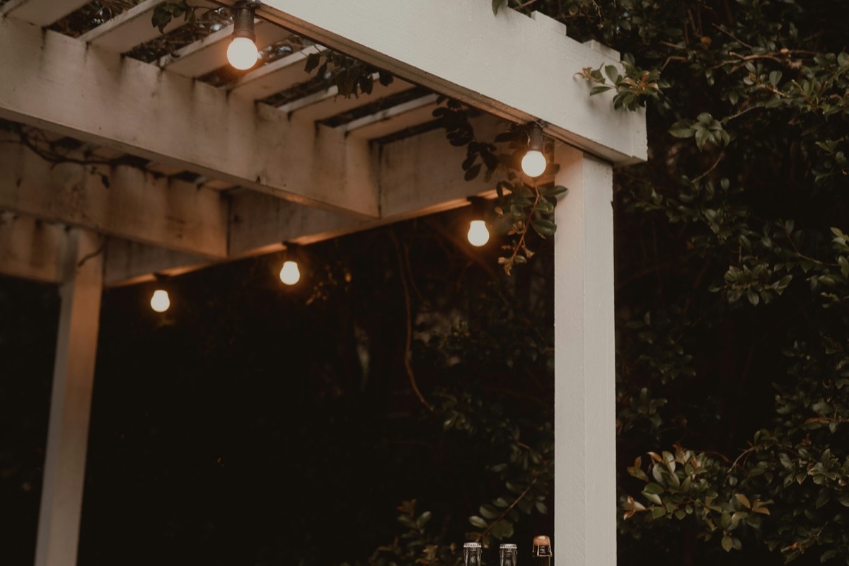 Outdoor bar with string lights at dusk