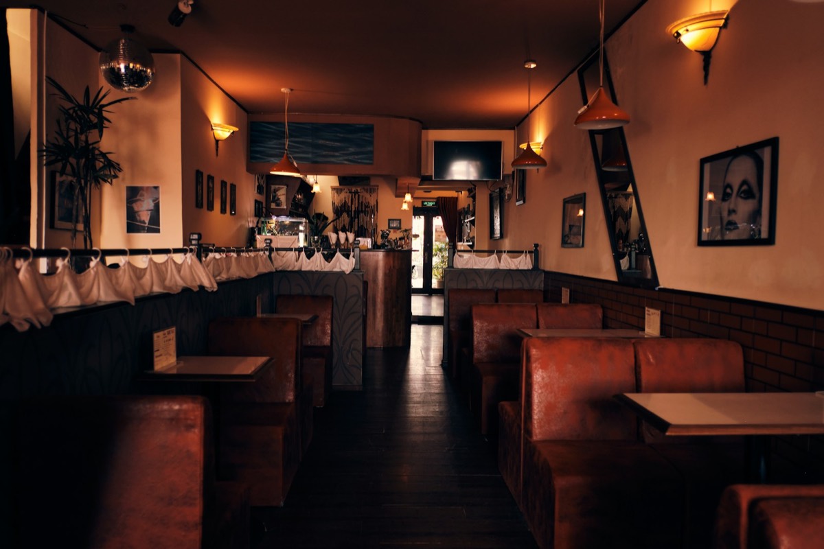 Warm restaurant interior with booths